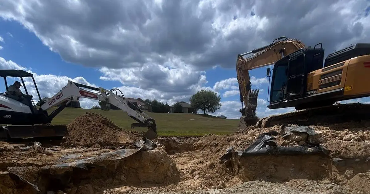 Excavators working a residential sinkhole remediation in Florida